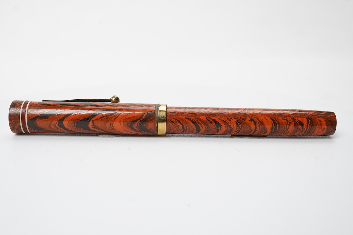 A Waterman Red Ripple No. 5 lever filler with red cap band and fitted with Waterman nib